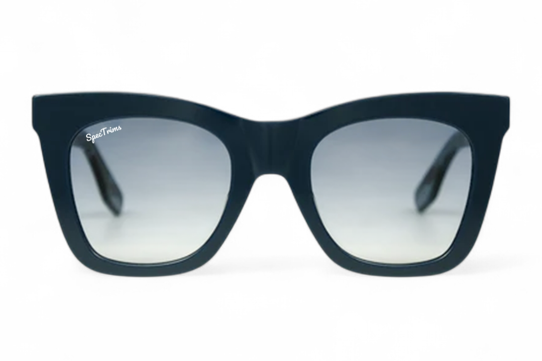 A pair of cat-eye sunglasses with a dark navy blue frame and gradient blue lenses, shown against a plain white background.